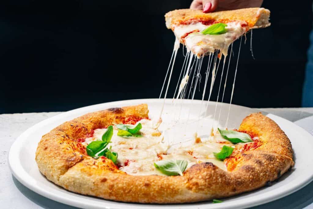 Whole pizza in close up with New Culture cheese melt