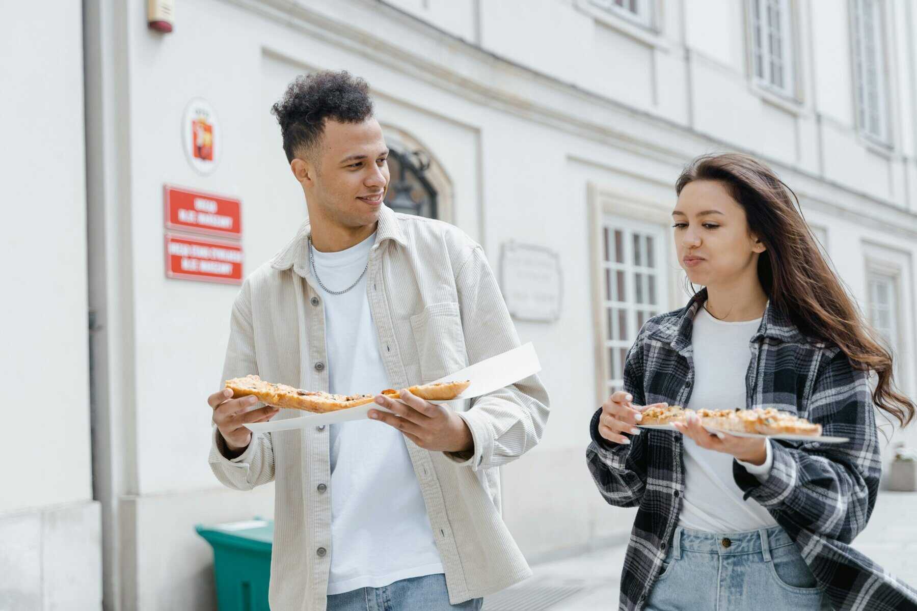 Young people eating burgers stock